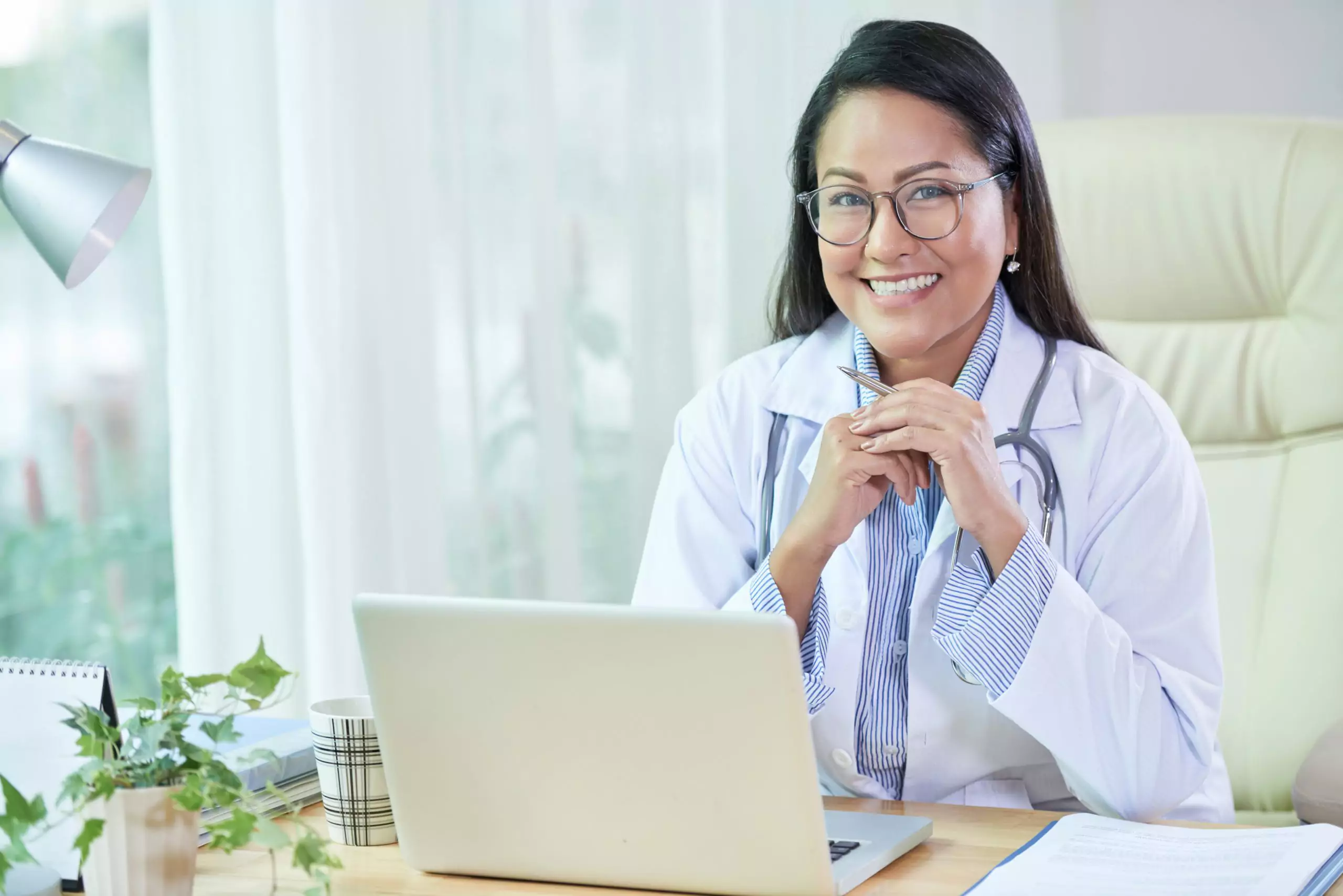 Smiling female gynecologist ready for fibroids patient appointment