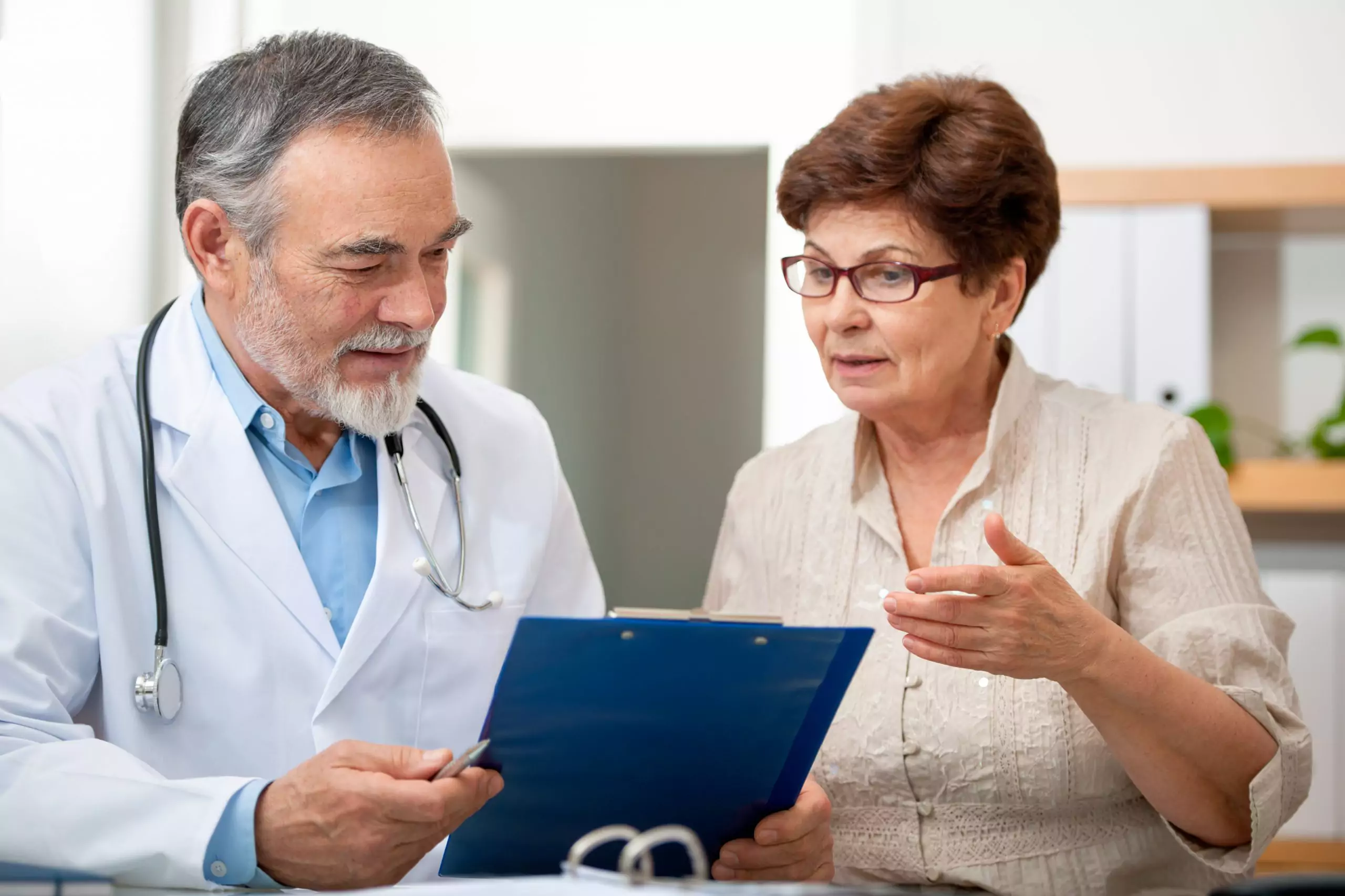 patient discussing the different clinical trial recruitment companies with her doctor