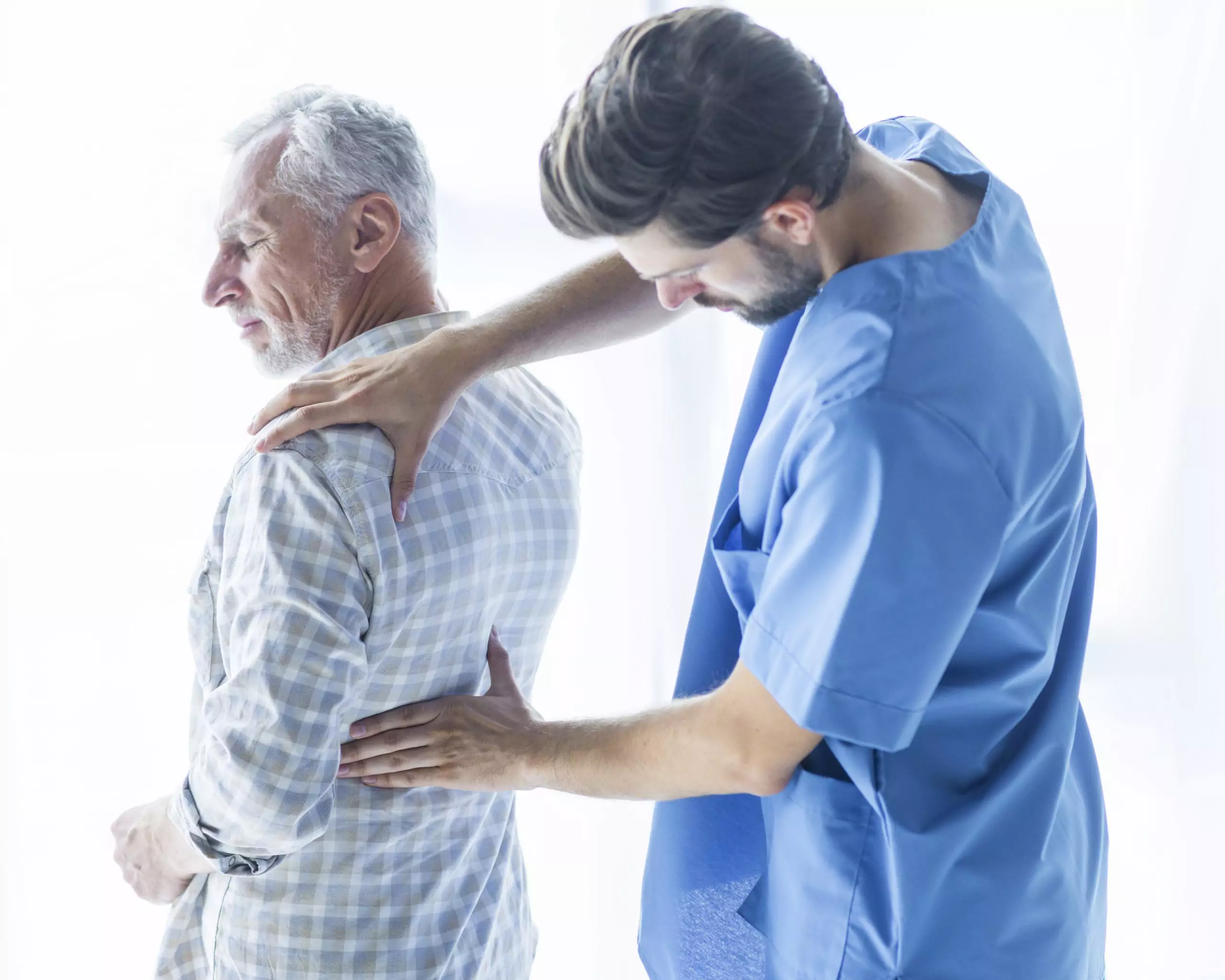 Doctor checking back pain on patient from kidney disease